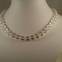 Collier cristal de roche perles intercalaires dorees