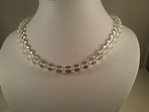 Collier cristal de roche perles intercalaires dorees